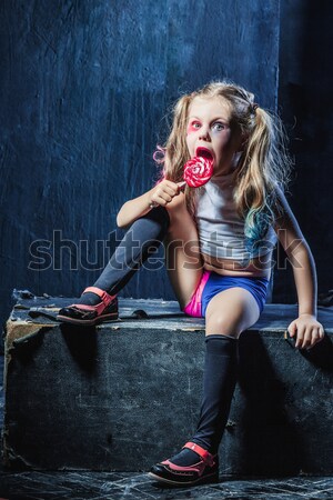 Halloween theme: Girl with baseball bat ready to hit Stock photo © master1305