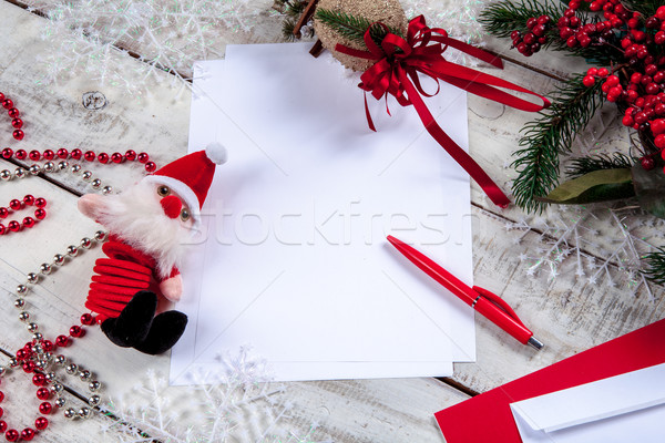 The blank sheet of paper on the wooden table with a pen  Stock photo © master1305