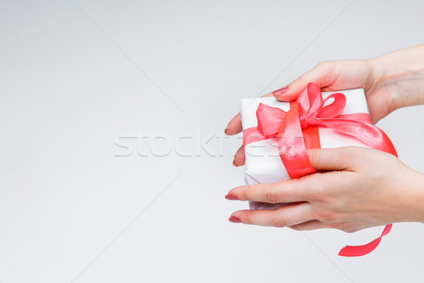 Stock photo: Female hands holding gift box