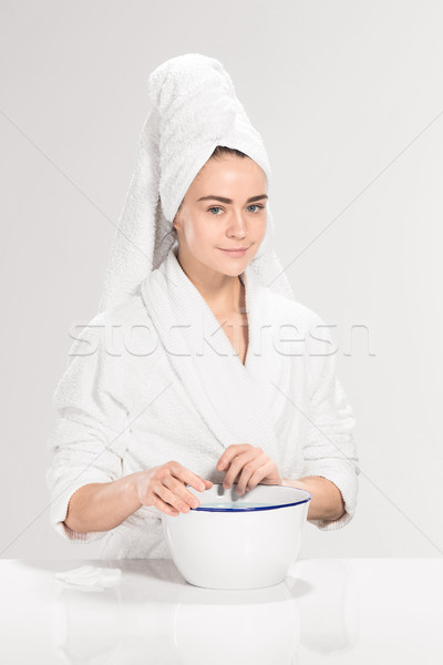 Woman cleaning face in bathroom Stock photo © master1305