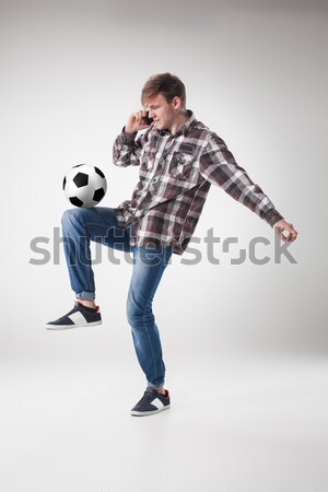 The guy with ball on gray background Stock photo © master1305