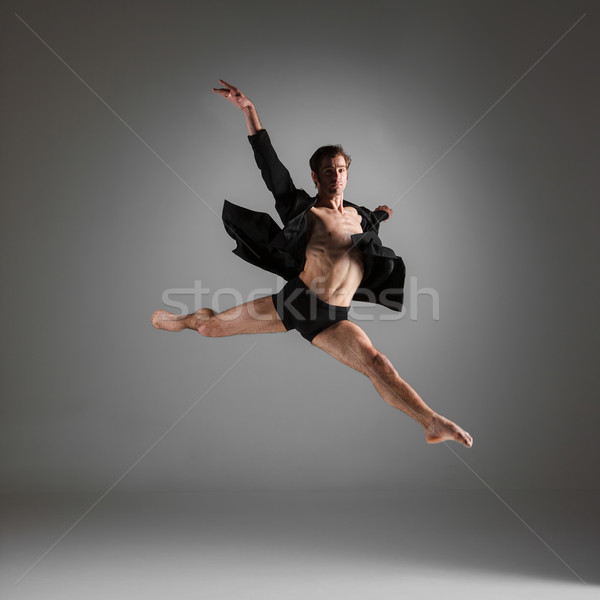 The young attractive modern ballet dancer jumping on white background Stock photo © master1305