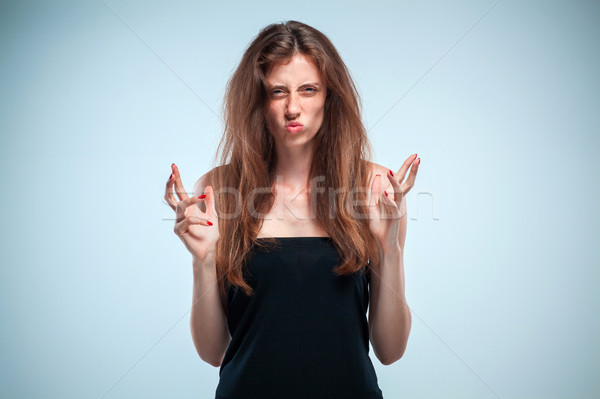 The disgusted and frowning young woman Stock photo © master1305