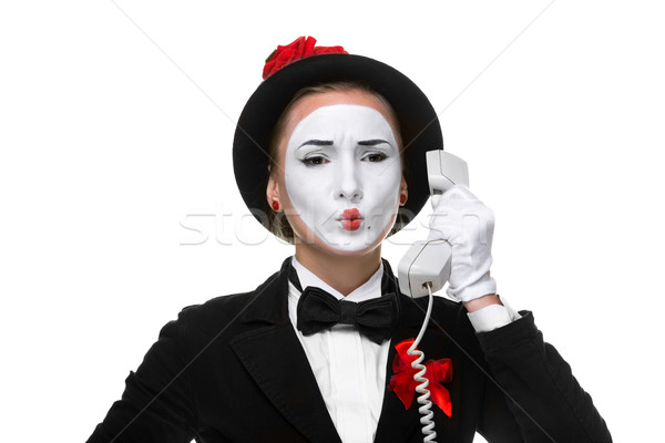Woman in the image mime holding a handset.  Stock photo © master1305