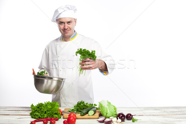 Chef cooking fresh vegetable salad in his kitchen Stock photo © master1305