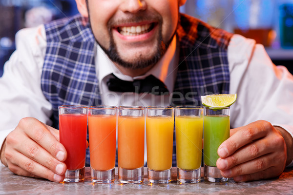Stock photo: Barman at work, preparing cocktails.