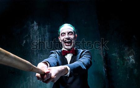 The scary clown and drip with blood on dack background. Halloween concept Stock photo © master1305