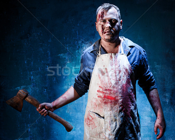Bloody Halloween theme: crazy killer as butcher with an ax Stock photo © master1305