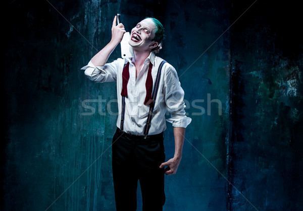 Stock photo: Bloody Halloween theme: crazy joker face