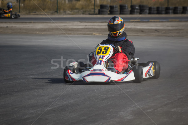 Karting - driver in helmet on kart circuit Stock photo © master1305