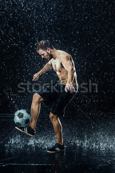 Water drops around football player Stock photo © master1305