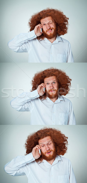 [[stock_photo]]: Portrait · perplexe · homme · parler · téléphone · gris