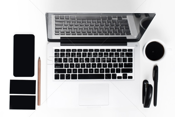 Business laptop, phone and a coffee on the white table  Stock photo © master1305