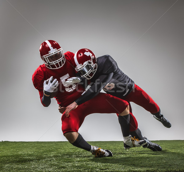 Stock photo: The two american football players in action