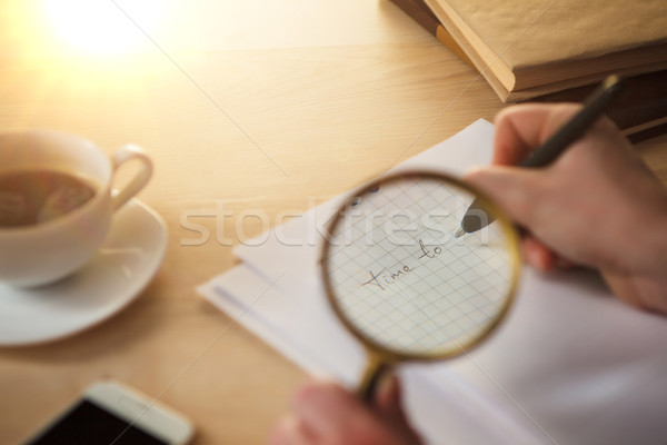 The male hands with a pencil and magnifying glass Stock photo © master1305
