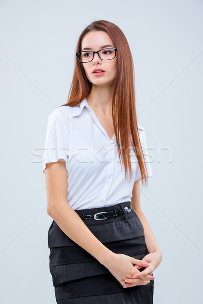 Stockfoto: Jonge · zakenvrouw · grijs · bril · vrouw · glimlach