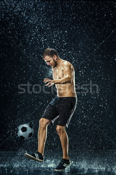 Vízcseppek körül futballista víz fekete sport Stock fotó © master1305