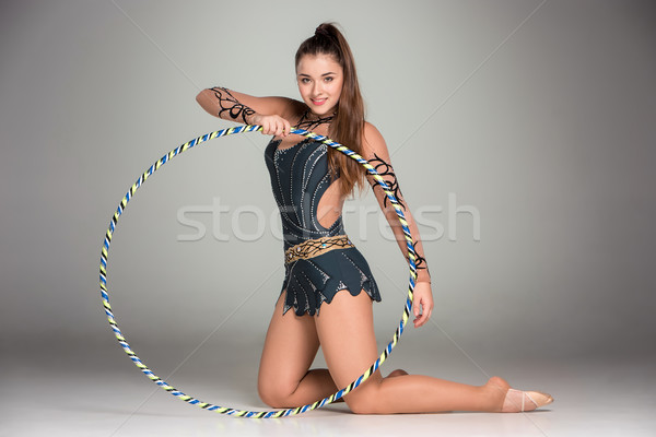 teenager doing gymnastics exercises with colorful hoop Stock photo © master1305