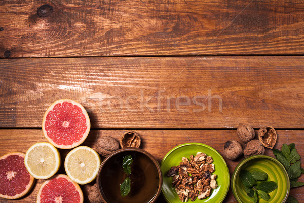 Lemon and walnut on a wooden surface close up Stock photo © master1305