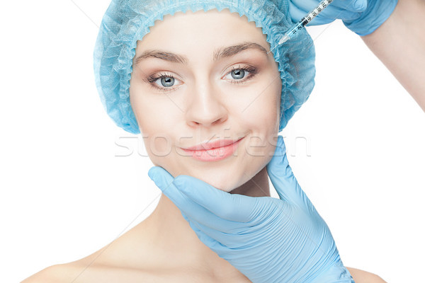 Femeie atragatoare chirurgie plastica seringă faţă atractiv fericit Imagine de stoc © master1305
