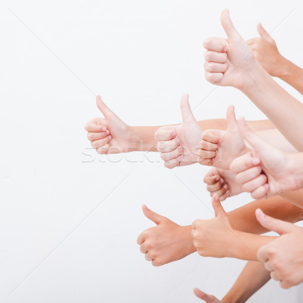 hands of teenagers showing okay sign on white  Stock photo © master1305
