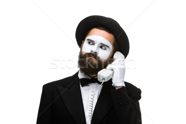 man in the image mime holding a handset.  Stock photo © master1305