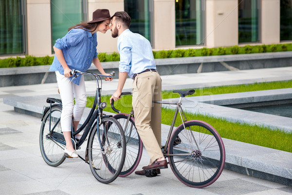 Stock photo: Romantic date of young couple on bicycles