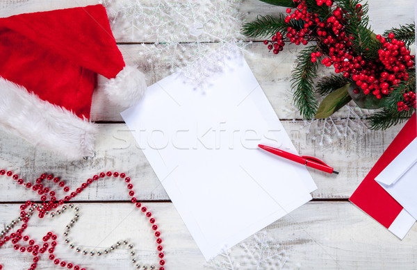 The blank sheet of paper on the wooden table with a pen  Stock photo © master1305