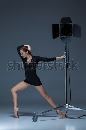 The beautiful ballerina posing on dack blue background   Stock photo © master1305