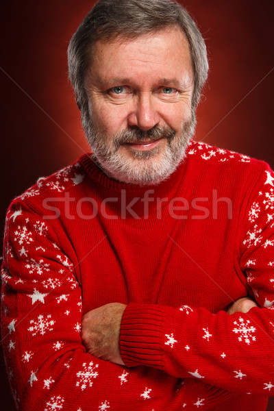 Elderly  smiling man on a red background Stock photo © master1305