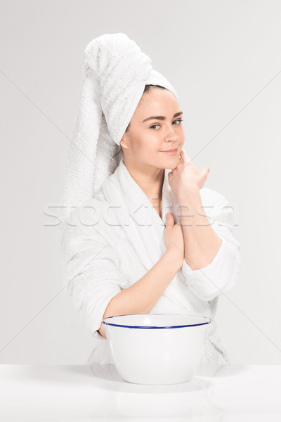 Woman cleaning face in bathroom Stock photo © master1305