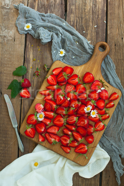 Fresh strawberry fruits, flowers, leaves on white wood table background Stock photo © master1305