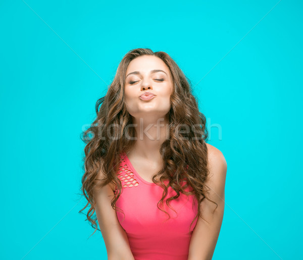 Stock photo: The young woman's portrait with happy emotions