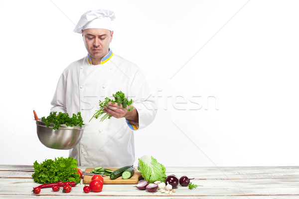 Chef cooking fresh vegetable salad in his kitchen Stock photo © master1305