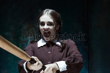 The crazy clown holding a knife on dack. Halloween concept Stock photo © master1305