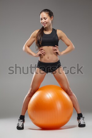 The young, beautiful, sports girl doing exercises on a fitball  Stock photo © master1305