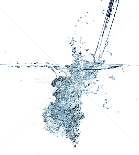 Water making bubbles upon being poured into more water. Stock photo © master1305