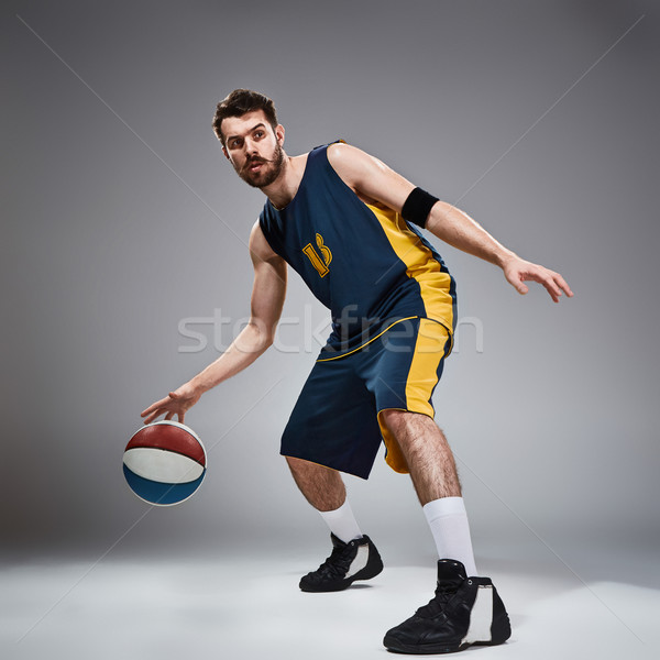 Full length portrait of a basketball player with ball  Stock photo © master1305
