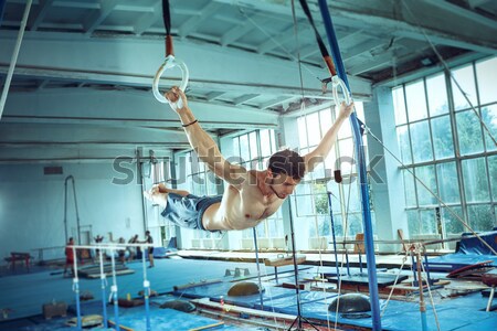 The sportsman during difficult exercise, sports gymnastics Stock photo © master1305