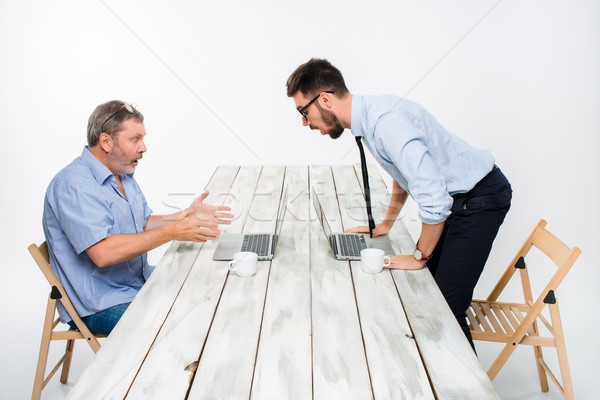 The two colleagues working together  at office on gray background Stock photo © master1305