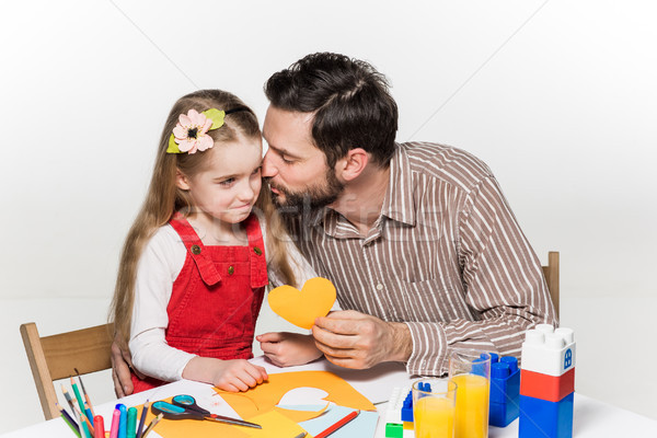 The daughter and father carving out paper applications  Stock photo © master1305