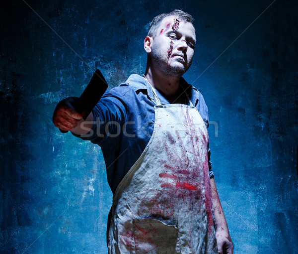 Bloody Halloween theme: crazy killer as butcher with a knife Stock photo © master1305