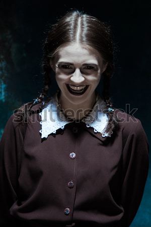 The crazy clown holding a knife on dack. Halloween concept Stock photo © master1305