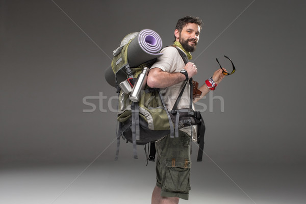 Portrait of a smiling male fully equipped tourist  Stock photo © master1305