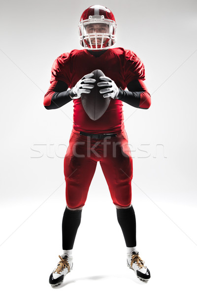 American football player posing with ball on white background Stock photo © master1305