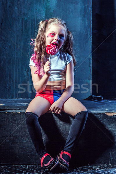 The funny crasy girl with candy on dark background Stock photo © master1305