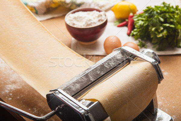 The fresh pasta and  machine on kitchen table Stock photo © master1305