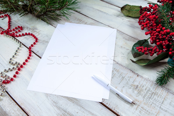 The blank sheet of paper on the wooden table with a pen  Stock photo © master1305