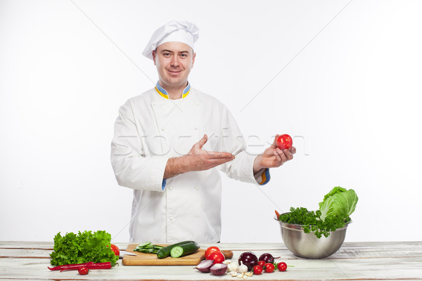 Chef cooking fresh vegetable salad in his kitchen Stock photo © master1305