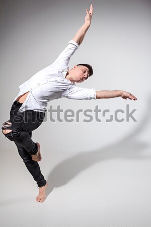 The young attractive modern ballet dancer jumping on white background Stock photo © master1305